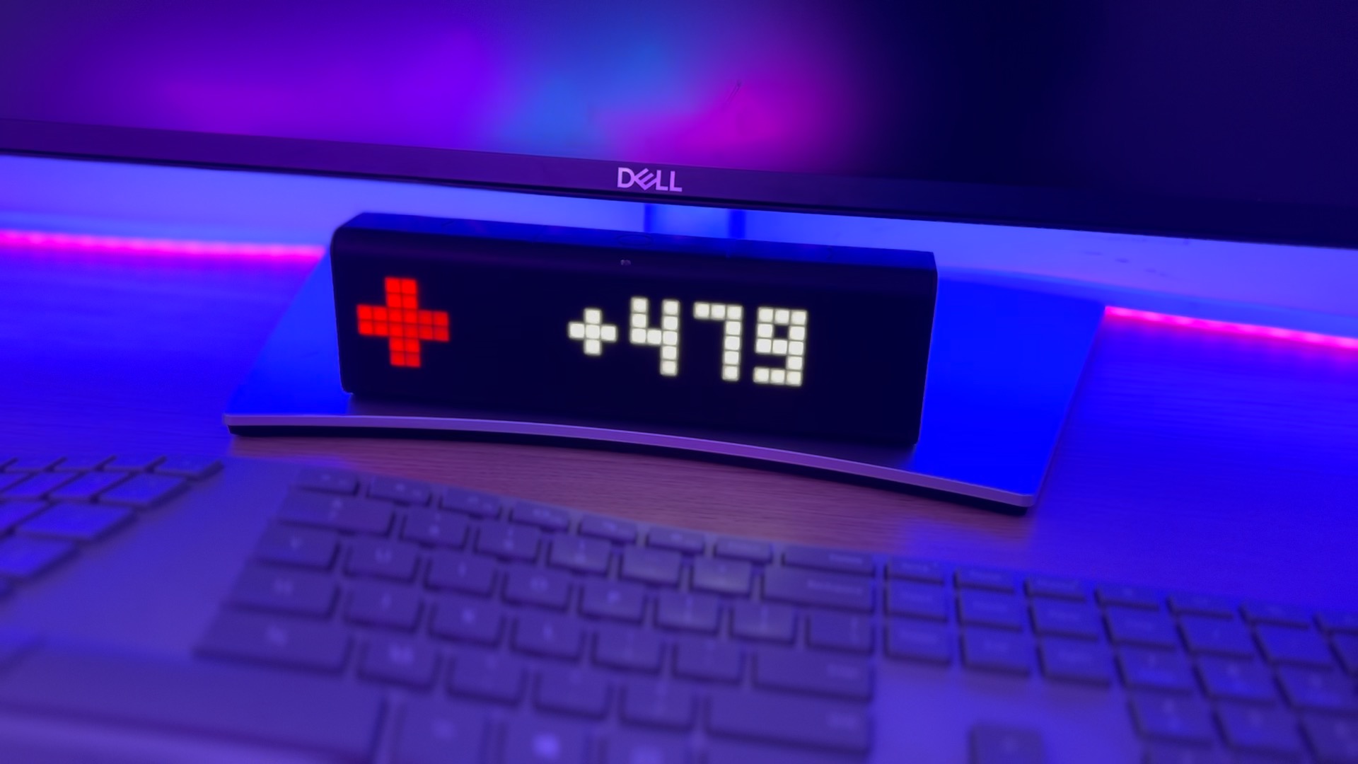 Smart display showing a red medical symbol next to the text +479