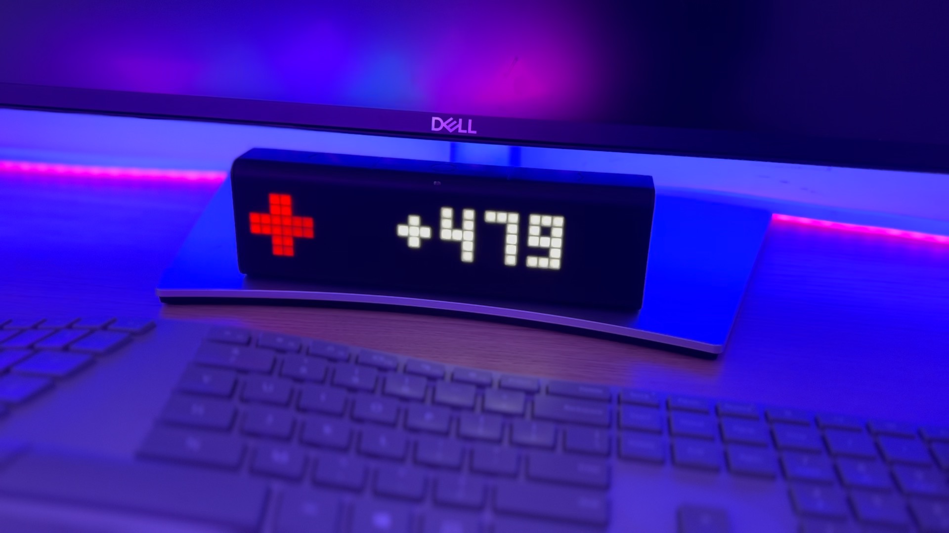 LED smart display showing a medical plus symbol with the numbers +489